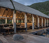 Sugarcane restaurant, Virgin Gorda, elegant outdoor dining pavilion with the hills in the background.